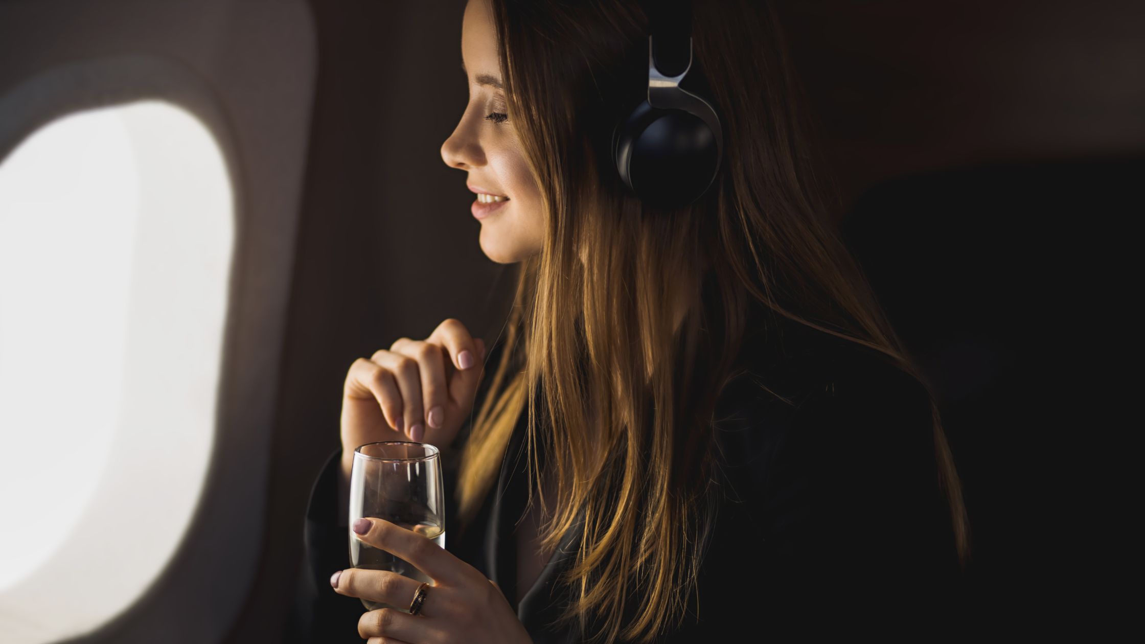 Woman drinking alcohol in a flight