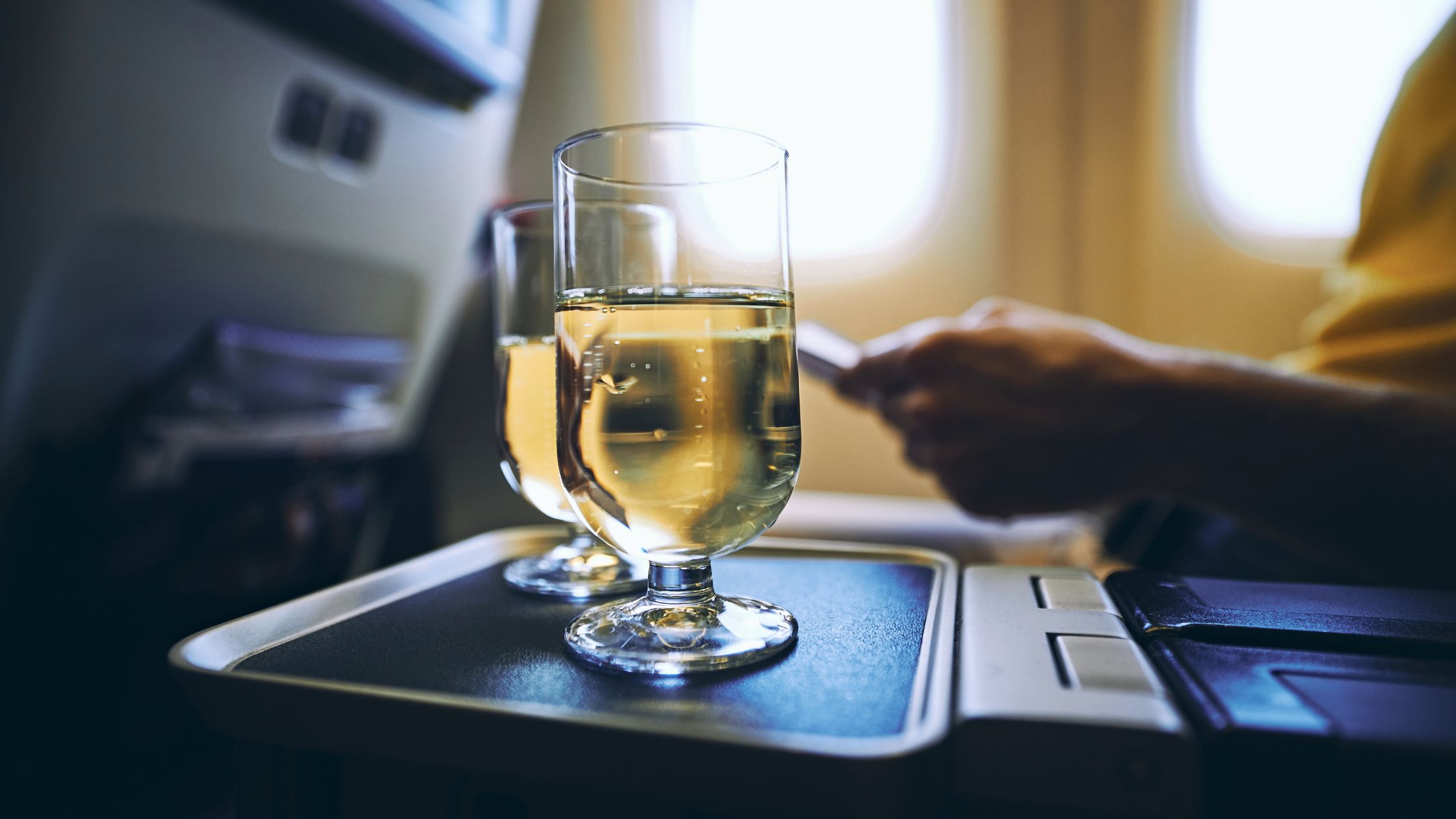 Two Glasses of Alcohol in a plane